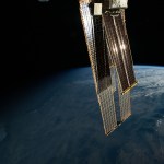 The first rays of an orbital sunrise reflect off the International Space Station's roll-out solar arrays that overshadow and augment the orbital outpost's main solar arrays. The space station was soaring 260 miles above Arizona northeast of Phoenix at the time of this photograph.